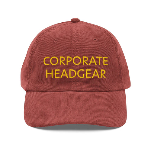 Corporate Headgear unstructured red corduroy cap with yellow embroidered text on the front panel.